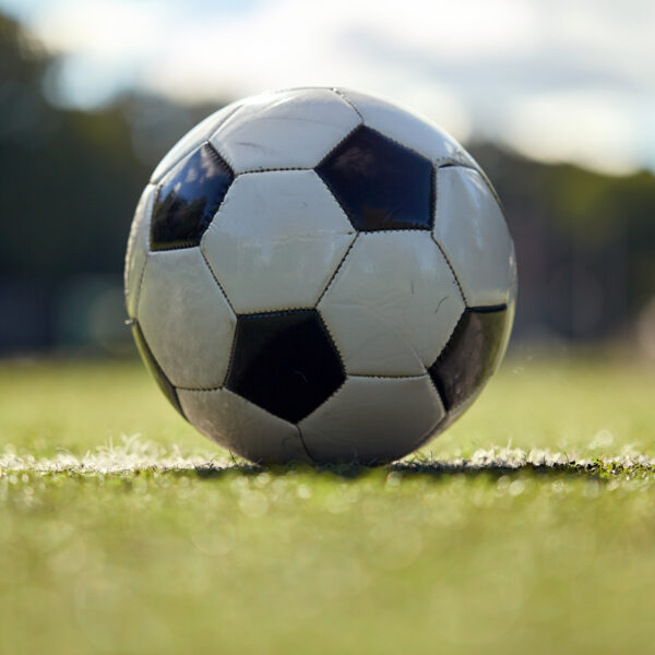 Soccer ball on football field